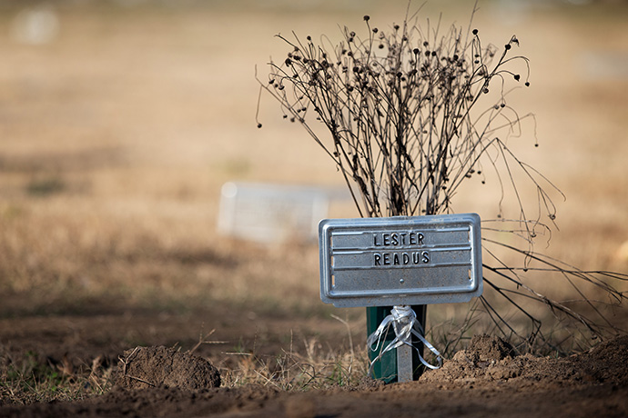 The grave of Lester Readus is identified with a temporary marker at Hills of Calvary Memorial Park in Nashville, Tenn. His burial was provided for by the Indigent Burial Program of Metro Nashville Social Services, which will also pay for a permanent, stone marker when it is finished. Photo by Mike DuBose, UM News.