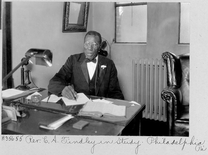 The Rev. C. A. Tindley works in his study in Philadelphia. Tindley served as a pastor in the Methodist Episcopal Church and was a noted gospel music composer. Photo © United Methodist Commission on Archives and History.