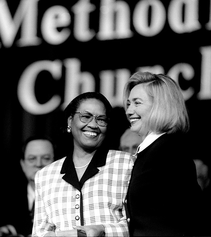 Mollie Stewart (left) presents a copy of the limited-edition hymnal for the 1996 United Methodist General Conference to Hillary Rodham Clinton after the then-first lady, a United Methodist, addressed the conference in Denver. Stewart was a member of the Commission on the General Conference. File photo by Mike DuBose, UM News.