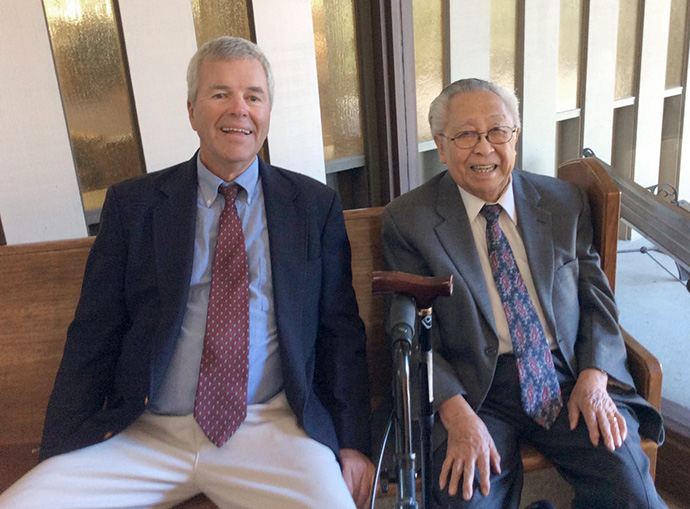 Bishop Wilbur Choy (right) sits next to Jeff Swenson, the late husband of retired Bishop Mary Ann Swenson, at a memorial service in September 2014. Choy ordained Bishop Swenson as a deacon and elder when he led the Pacific Northwest Conference. “The conference flourished under his leadership,” she said. Photo by Bishop Swenson.