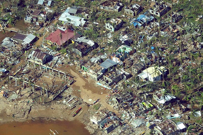 Typhoon Odette caused massive damage to Surigao City in the northern part of Mindanao in the Philippines in December 2021. With many homes destroyed, people continue sheltering in local churches, day care centers, municipal buildings, schools and sports facilities. Photo courtesy of the Philippine Coast Guard via Wikipedia.