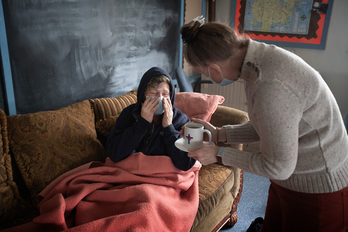 The Rev. Ruth Marsh offers a cup of tea to Angi Rogers, a guest in the day shelter at Trinity United Methodist Church in Idaho Falls, Idaho. Rogers had not been feeling well and Marsh settled her in a Sunday school classroom to get some rest. “Everybody here takes care of me and each other,” Rogers said. 