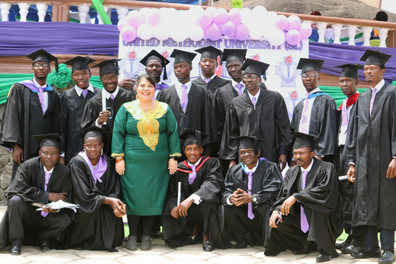 A cross section of students who graduated Feb. 26 from Sierra Leone’s United Methodist University. In the center is the Rev. Katie Meek, the university’s deputy registrar. The school was founded by the late Sierra Leone Area Bishop John K. Yambasu who died in 2020. Photo by Phileas Jusu, UM News.