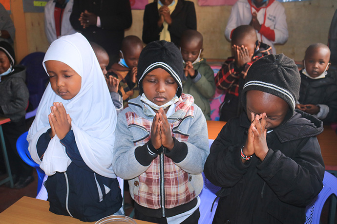 Christian and Muslim students pray together at the Kenya Airport Police Unit Chapel Academy, which was founded by United Methodist Chaplain Eliud Karanja in 2021. Photo by Gad Maiga, UM News.