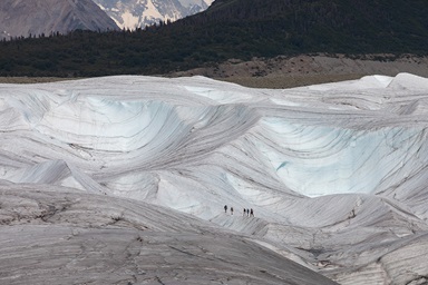 Hikers make their way across Kennicott Glacier near McCarthy, Alaska, in 2021. Scientists say glaciers worldwide are projected to lose anywhere from 18% to 36% of their mass by 2100, resulting in almost 10 inches of sea level rise. Photo by Mike DuBose, UM News. Hikers make their way across Kennicott Glacier near McCarthy, Alaska, in 2021. Scientists say glaciers worldwide are projected to lose anywhere from 18% to 36% of their mass by 2100, resulting in almost 10 inches of sea level rise. Photo by Mike DuBose, UM News.