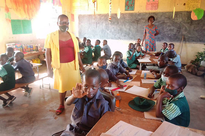 Theocracy Tasweranadzo, 10, raises his hand in class at Munyarari Primary School in Mutare, Zimbabwe. A former student at The United Methodist Church’s mission school has created a scholarship program for the three best students in each class. Photo by Kudzai Chingwe, UM News. 
