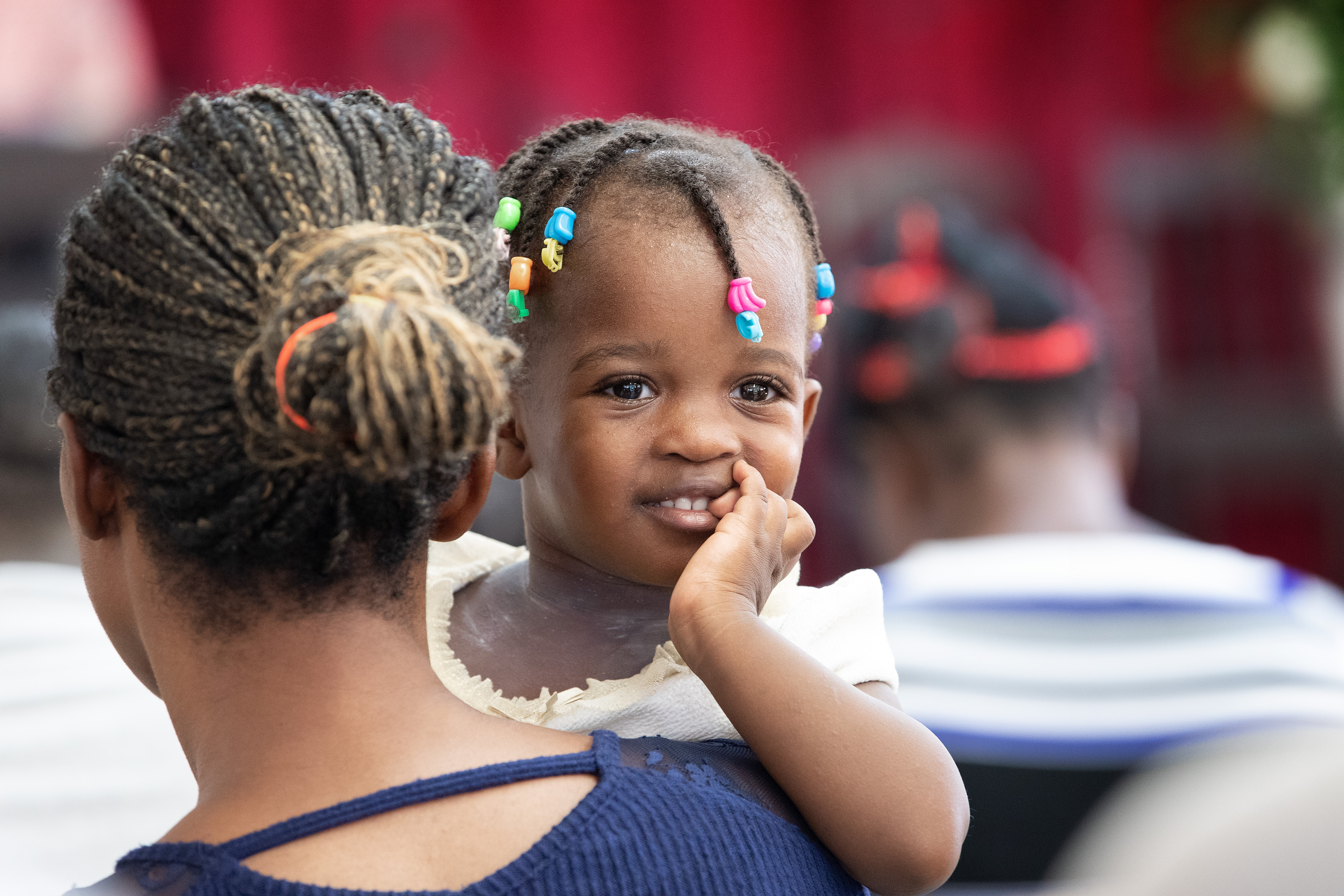 A Haitian migrant mother attends a service with her daughter at the 7th Baptist Church of Tapachula, Mexico, where a shelter and a French- and Creole-speaking congregation have been established to serve this migrant population. Photo Mike DuBose, UM News.