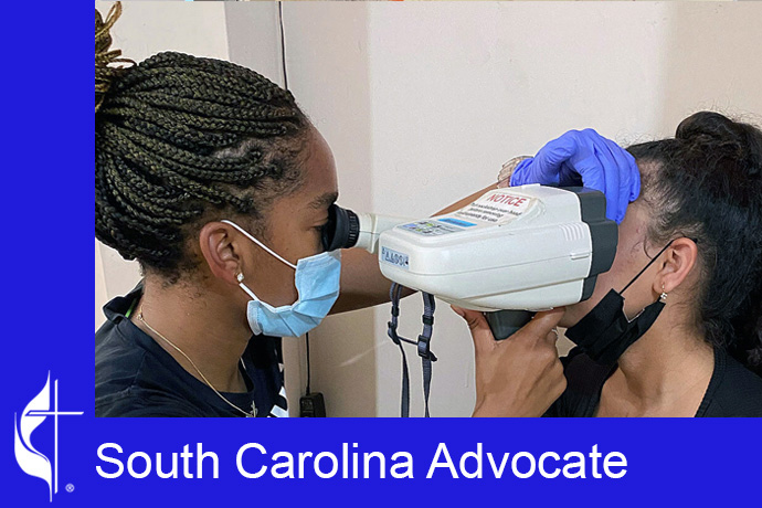 A student from the Methodist Student Network — the United Methodist campus ministry at the University of South Carolina in Columbia, S.C., — examines a patient. The MSN has served more than 10,000 people though their mobile optometry clinic run with a supporting optometrist. Photo courtesy of Methodist Student Network.