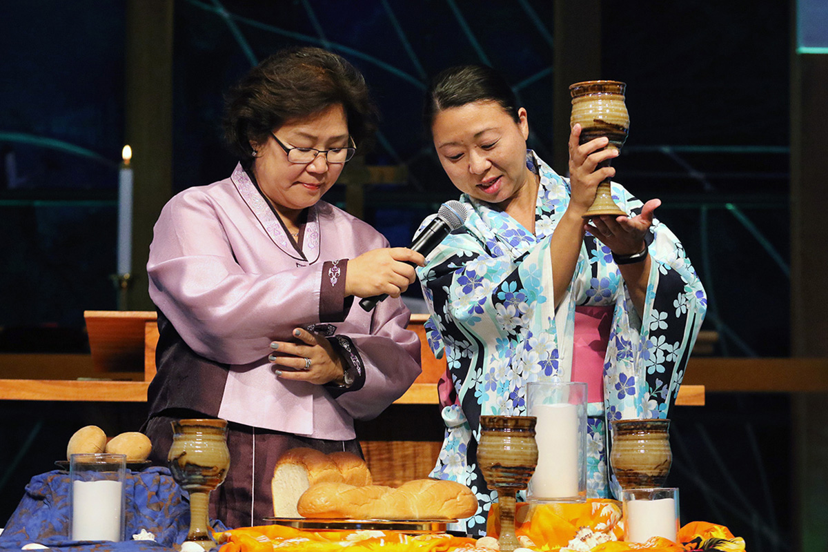 The Revs. Pauline Kang and Motoe Foor lead Holy Communion during opening worship at the 2018 Ohana Conference in Honolulu, Hawaii. The conference was held by the Association of Asian American and Pacific Islander Clergywomen (AAPIC) and the National Association of Korean American United Methodist Clergywomen (NAKAUMC). Photo by Thomas Kim, UM News.