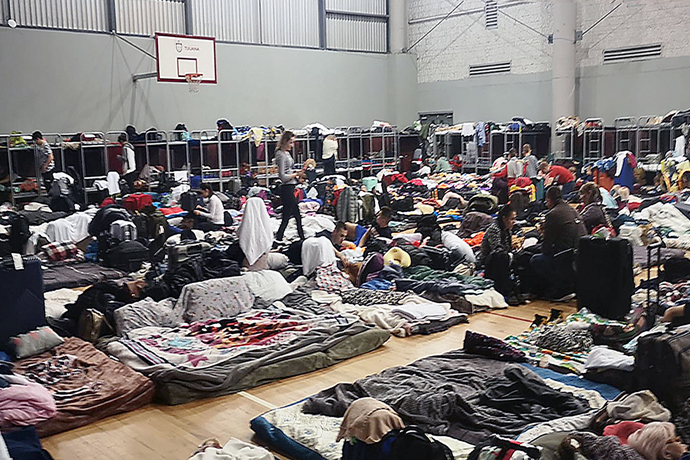 City officials in Tijuana, Mexico, have arranged the use of a covered gym near the San Ysidro border point for helping more than 1,800 people from Ukraine. The refugees are housed there temporarily as they await processing of their applications to enter the United States. The procedures are taking three to four days. Photo courtesy of Bishop Felipe Ruiz, Methodist Church of Mexico A.R.