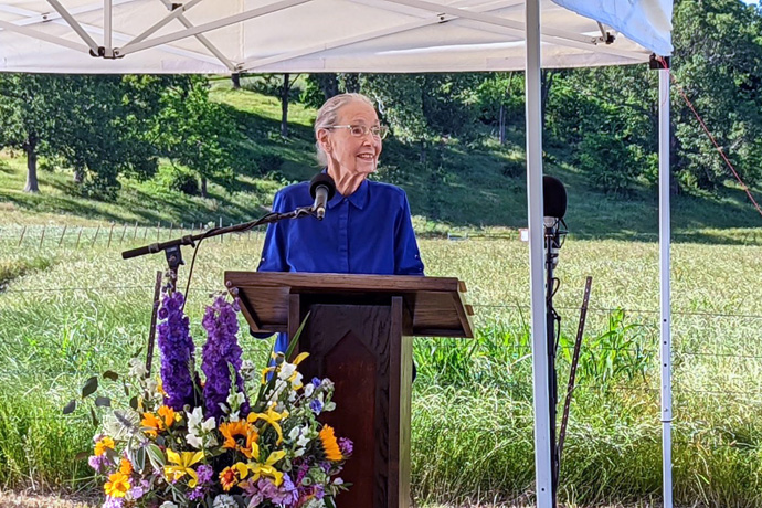 Betty Hinshaw addresses the crowd at the June 2 dedication of the Betty Hinshaw Bird Sanctuary in Tontitown, Arkansas. The 97-year-old United Methodist gave 25 acres to the Northwest Arkansas Land Trust for creation of the sanctuary. Photo courtesy of the Rev. Andrew Thompson.
