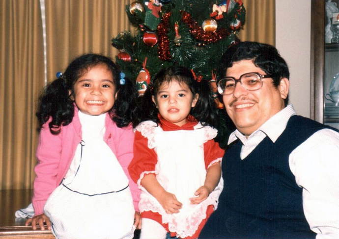 The Rev. Roberto Gómez in a Christmas photo with young daughters Laura (left) and Amy. Photo courtesy of the Gómez family.