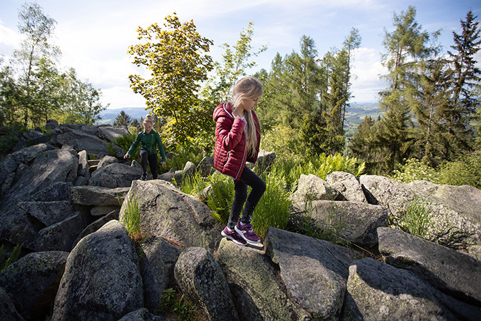Ukrainian refugees Jeva (right) and Polina enjoy a hike atop Mářský Hill in Svatá Maří. Czech Republic. The Rev. Zdeněk Neužil of The United Methodist Church in the Czech Republic, brought a group to enjoy the view after lunch at the Veselka United Methodist retreat center, which is housing families from Ukraine who fled the war with Russia. Photo by Mike DuBose, UM News.