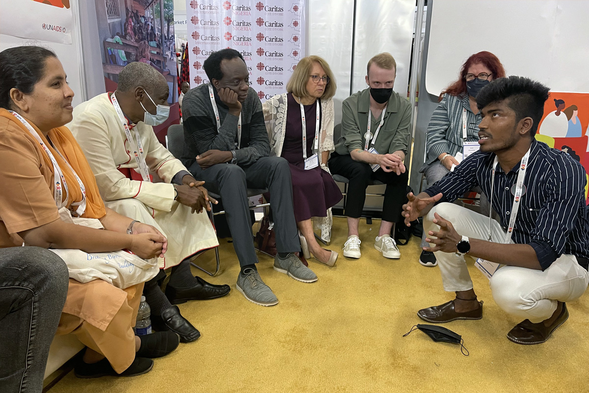 Faith leaders from around the world discuss HIV issues facing young people at the 24th International AIDS Conference, July 29-Aug. 2 in Montreal. Pictured are (from left) Sr. Crina Cardozo, Human Touch, Goa; The Rev. Canon Gideon Byamugisha, Anglican priest in Uganda; Gibstar Makangila, executive director, Circle of Hope, Zambia; Dr. Susan Hillis, senior technical advisor, Faith and Communities Initiatives, Office of the Global AIDS Ambassador and Health Diplomacy; Gareth Jones, Youth Programme consultant, UNAIDS; Suki Beavers, director, Equality and Rights for All, UNAIDS; and an unidentified man. Photo by Don Messer.