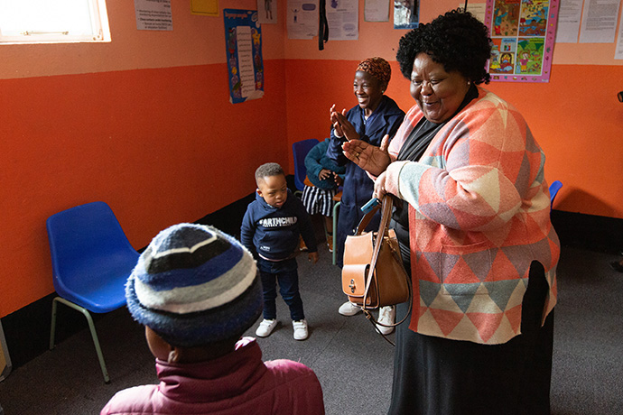 The Rev. Maureen Figlan (right) dances with children at the Nomaxabiso Centre for Children. At rear is teacher Cetyiswa Shumi. Figlan is superintendent of The United Methodist Church’s Cape Coastal District. Photo by Mike DuBose, UM News.