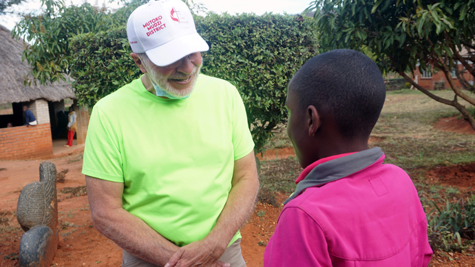 The Rev. Dave Marty, a retired pastor from Indiana, meets one of the children he sponsors in Zimbabwe for the first time during a July 13-Aug. 4 mission trip to the Zimbabwe Episcopal Area. Photo by Kudzai Chingwe, UM News.