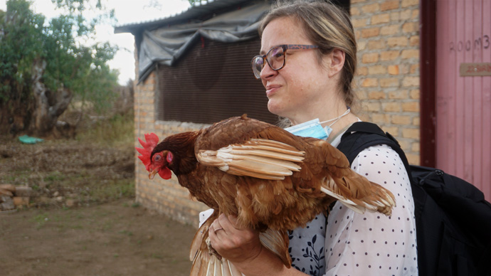The Rev. Michelle White, pastor of Winamac United Methodist Church in Winamac, Ind., holds a rooster that is part of the Mission Huku project in the Makoni Buhera District of Zimbabwe. Photo by Kudzai Chingwe, UM News.