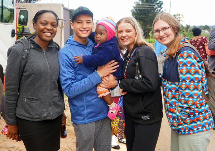 On a July 13-Aug. 4 mission trip, visitors from the Indiana Conference’s Northwest District and the Wesley Foundation of Purdue enjoyed meeting church members in the Zimbabwe Episcopal Area. The young adults were especially attached to the children they met. Pictured are (from left) Tsitsi Mumbuya, Shaun Pratt, Rylee Daugherty and Megan Stohr. Photo by Kudzai Chingwe, UM News.