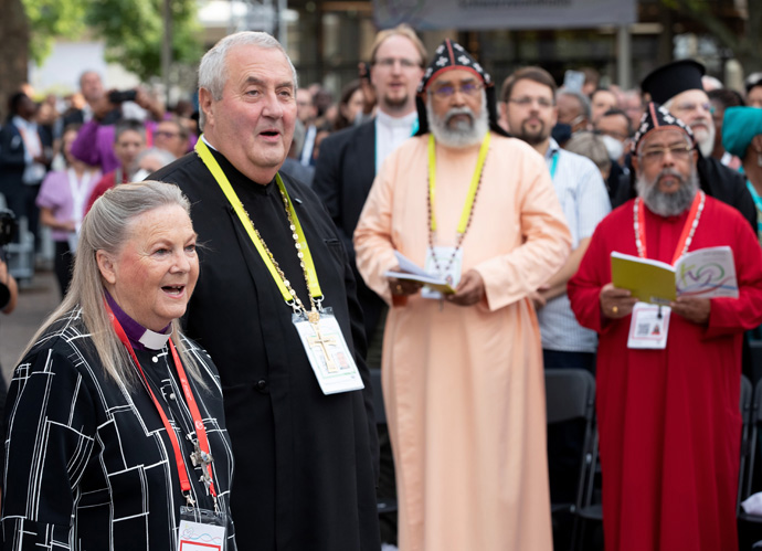 United Methodist Bishop Mary Ann Swenson (left) and the Rev. Ioan Sauca join in singing during the opening prayer service for the World Council of Churches' 11th Assembly in Karlsruhe, Germany, Aug. 31. The assembly took place Aug. 31-Sept. 8 under the theme "Christ's Love Moves the World to Reconciliation and Unity." Photo by Mike DuBose, UM News.