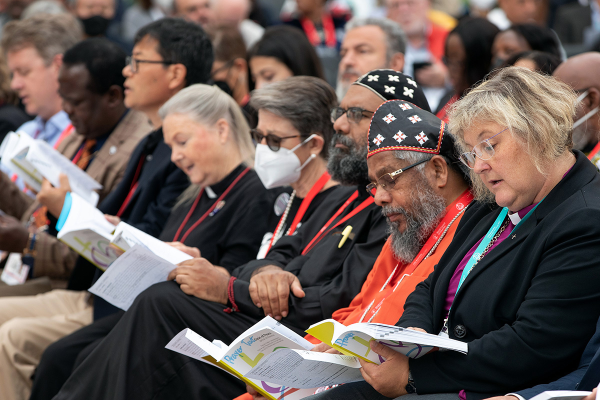 Faith leaders from around the world join together during the closing prayer service for the World Council of Churches' 11th Assembly in Karlsruhe, Germany. From right are: The Rev. Heike Springhart of the Evangelical Church in Germany, Bishop Abraham Mar Paulos of the Mar Thoma Syrian Church of Malabar, Metropolitan Zacariah Mar Nicholovos of the Malankara Orthodox Syrian Church, United Methodist Bishops Sally Dyck and Mary Ann Swenson from the U.S., and the Rev. Hyuk Cho of the United Church of Canada. Photo by Mike DuBose, UM News.