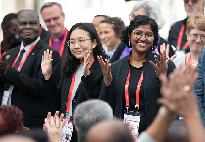 New members of the Central Committee of the World Council of Churches greet the congregation in sign language during the closing prayer service for the WCC Assembly. Among the new leaders is the Rev. Ann Jacob (right, front), a pastor at Edmonds (Wash.) United Methodist Church. Photo by Mike DuBose, UM News.