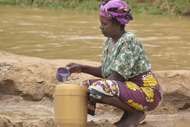 Alice Charo, a cattle herder in Shirikisho village in Kenya, fetches water at the Tana River for her family. Charo has lost 10 cows in 14 days due to the ongoing drought in Tana River County. The river’s water levels have hit record lows, forcing herders like Charo to travel miles along the river to find a safe place to fetch water for their cattle. Photo by Gad Maiga, UM News. Alice Charo, a cattle herder in Shirikisho village in Kenya, fetches water at the Tana River for her family. Charo has lost 10 cows in 14 days due to the ongoing drought in Tana River County. The river’s water levels have hit record lows, forcing herders like Charo to travel miles along the river to find a safe place to fetch water for their cattle. Photo by Gad Maiga, UM News.