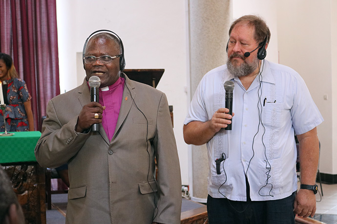 Donald Reasoner translates for Bishop Jóse Quipungo of the East Angola Episcopal Area during the 2022 Africa Colleges of Bishops retreat at Africa University in Mutare, Zimbabwe. Quipungo was addressing the university community in Portuguese during a Sept. 7 worship service. Photo by Eveline Chikwanah, UM News.