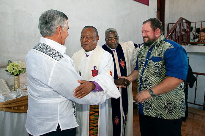 Donald Reasoner (right) and the Rev. R. Randy Day (left) greet Angolan Bishops Emilio J. M. DeCarvalho (center, left) and Moises Domingos Fernandes during the 2006 West Angola Annual Conference meeting in Luanda. File photo by Mike DuBose, UM News.