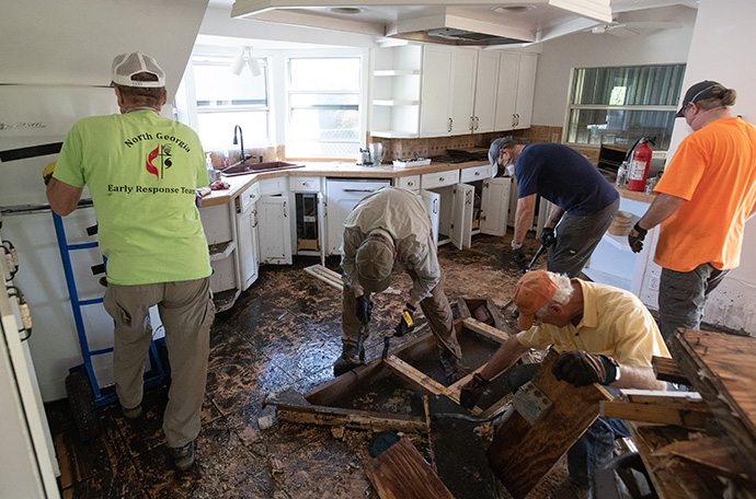 Members of a volunteer team from the North Georgia Conference of The United Methodist Church clean out a home in Fort Myers, Fla., on Oct. 5, after it was flooded by Hurricane Ian. The United Methodist Board of Global Ministries approved a $2 million increase in funding for U.S. conference disaster ministry programs in 2023. File photo by Mike DuBose, UM News.