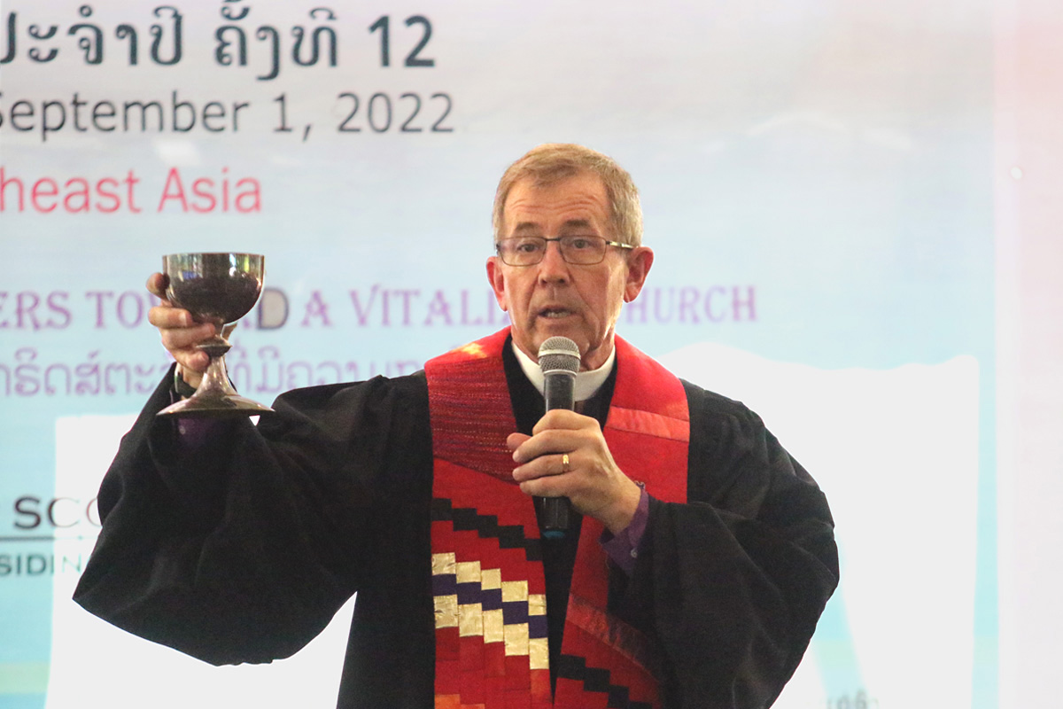 Bishop Scott Jones, who presided over the 12th annual gathering of the Laos Samphan Methodist Church mission in Vientiane, Laos, celebrates Holy Communion on Sept. 1. Members from across the country gathered Aug. 30-Sept. 4 for the first such gathering in Laos since the mission officially started in 2006. Photo by Thomas E. Kim, UM News. 