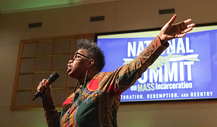 The Rev. Leslie Oliver, pastor at Sanctuary Outreach Ministries in Charlotte, North Carolina, leads music during morning worship at the National Summit on Mass Incarceration. Photo by Joey Butler, UM News.