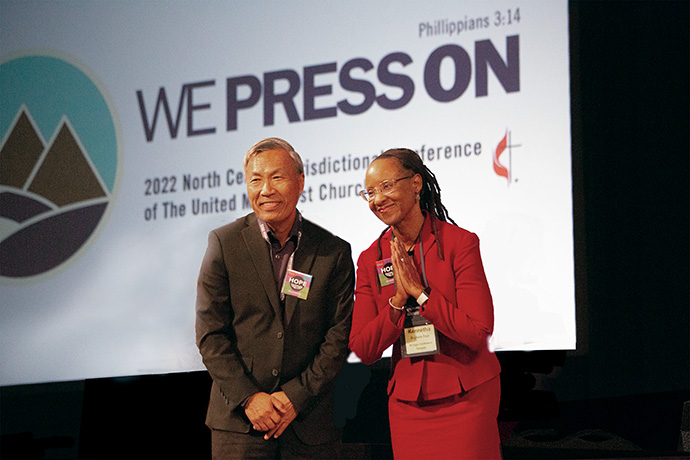 The Rev. Kennetha Bigham-Tsai (right) and her husband, Kee, greet delegates at the North Central Jurisdictional Conference meeting in Fort Wayne, Ind., following her election as bishop. Photo courtesy of NCJ Communications.