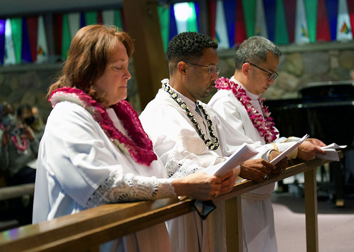 Newly elected Bishops Dottie Escobedo-Frank (left), Cedrick D. Bridgeforth and Carlo A. Rapanut kneel during a consecration service Nov. 5 at Christ United Methodist Church in Salt Lake City, Utah. All three were elected by Western Jurisdictional Conference delegates on Nov. 4. Photo by Patrick Scriven, Pacific Northwest Conference, for the Western Jurisdiction.
