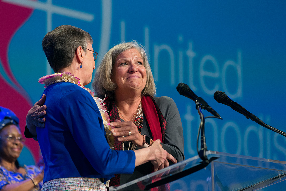 Dawn Wiggins Hare (right), top executive of the United Methodist Commission on the Status and Role of Women, becomes emotional as she and Harriett Jane Olson, United Methodist Women (now United Women in Faith) chief executive officer, lament the failure of two amendments to the church's constitution focused on equality in the church for women and girls during the United Methodist Women Assembly 2018 in Columbus, Ohio. The Commission on the Status and Role of Women is celebrating its 50th anniversary this year. File photo by Mike DuBose, UM News.