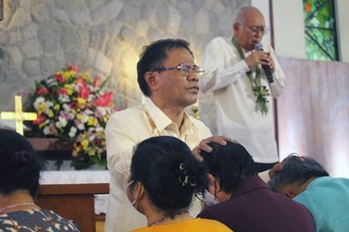 Retired Bishop Leo A. Soriano (back right) prays for episcopal candidates as Bishop Rodolfo A. Juan lays hands on them during the third Revive event held Nov. 23 at the newly inaugurated Wesleyan University-Philippines Chapel in Cabanatuan City, Philippines. The event was designed to spiritually prepare delegates and other United Methodists before the election of three new bishops during the special session of the Philippines Central Conference. Photo by Gladys P. Mangiduyos, UM News.