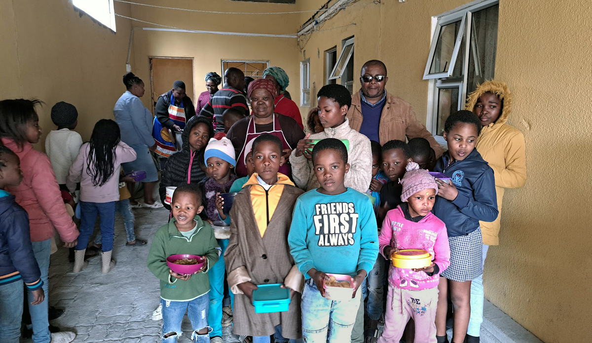 Children from the Philippi neighborhood in Cape Town, South Africa, pose for pictures after receiving meals at Masakhane Soup Kitchen. Many families in the community were hard hit by the COVID-19 pandemic. The food kitchen currently operates twice a week and serves about 200 kids and some parents. Photo by Alvin Makunike, UM News.