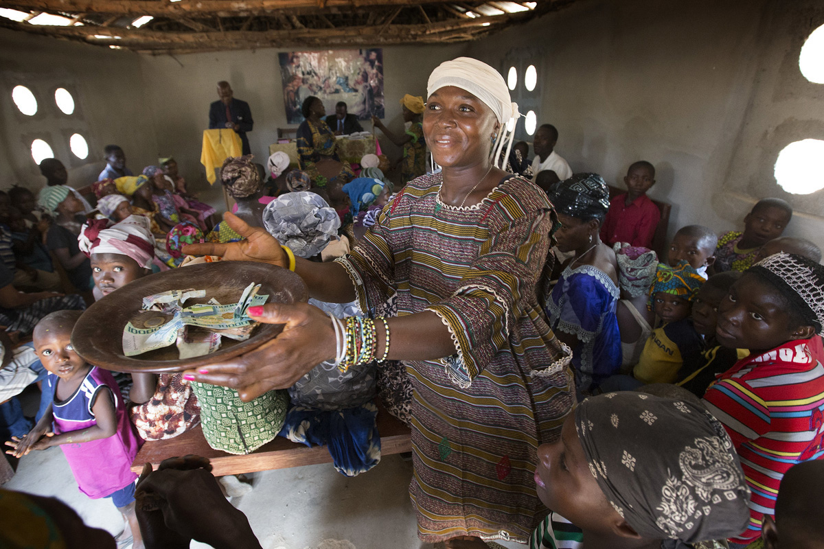 Zainab Koroma collects the offering at a United Methodist church in Fulawahun, near Bo, Sierra Leone. Overall, The United Methodist Church saw a slight increase in giving to denomination-wide ministries in 2022, compared to the previous year. File photo by Mike DuBose, UM News.