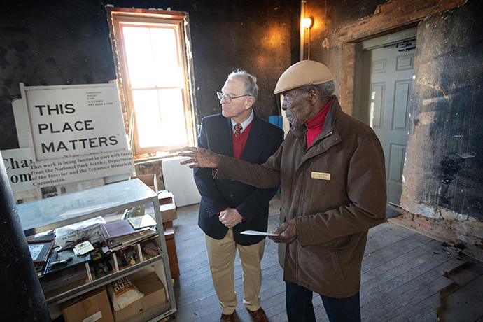 Harry Harris of the Wilson County Black History Committee (right) gives the Rev. Carleton Thackston a tour of Pickett Chapel in Lebanon, Tenn., which is undergoing renovations. Photo by Mike DuBose, UM News.