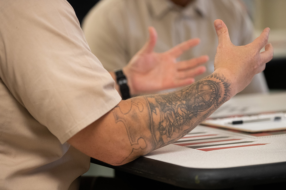 Anthony (foreground), who is incarcerated at the St. Marys Correctional Center in St. Marys, W.Va., says he tries to serve as a role model for new inmates at the facility after seeing the transformation brought about by the Kairos Prison Ministry. Photo by Mike DuBose, UM News.