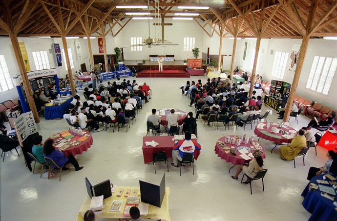 Students and recruiters meet in the main assembly hall at Gulfside Assembly in Waveland, Miss., for a higher education recruiting fair in 1997. File photo by Mike DuBose, UM News.