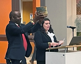 Bishop Mande Muyombo, chair of the Connectional Table, holds up a drum created by potter Terance Painter of Maggie Valley, N.C., gifted to him Feb. 23 during the Connectional Table’s meeting in Atlanta. Photo by Jim Patterson, UM News.
