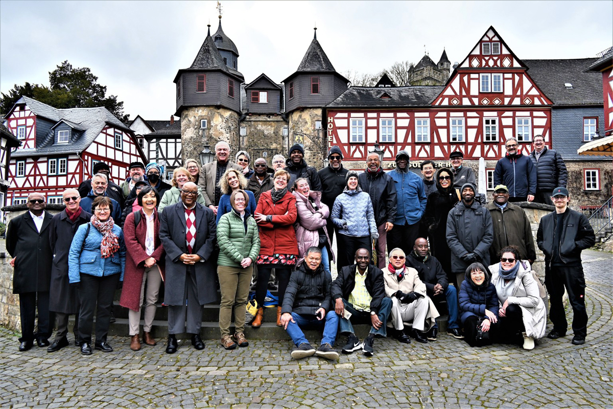 The Standing Committee on Central Conference Matters, an international United Methodist leadership body, gathers in front of the entrance to a medieval castle in Braunfels, Germany. During a meeting in Braunfels, the group discussed the challenges facing its proposed Africa Comprehensive Plan, which would add five more bishops to the continent. Photo by Klaus Ulrich Ruof, Germany Central Conference.  