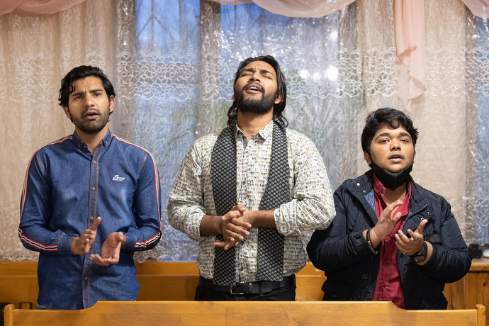 Students from Pakistan sing during worship at Bishkek United Methodist Church. From left are Thomson Gill, Yashib Nayab and Prince Javaid. Photo by Mike DuBose, UM News.