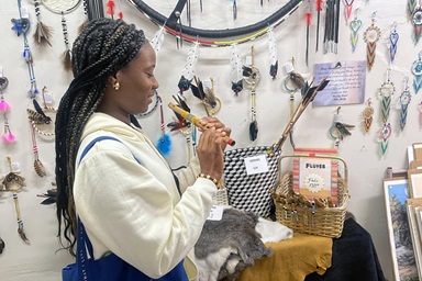 Ebiye Seimode, a student at the Boston University School of Theology and participant in the Oklahoma Indian Missionary Conference Immersion Experience, samples a flute for sale at Oklahoma Native Art & Jewelry on March 9, 2023, in Oklahoma City. Photo by Jim Patterson, UM News. Ebiye Seimode, a student at the Boston University School of Theology and participant in the Oklahoma Indian Missionary Conference Immersion Experience, samples a flute for sale at Oklahoma Native Art & Jewelry on March 9, 2023, in Oklahoma City. Photo by Jim Patterson, UM News.
