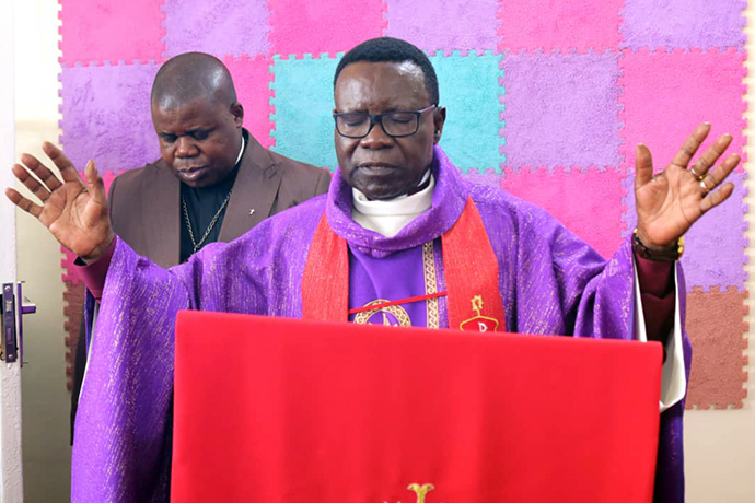 United Methodist Bishop Owan Kasap dedicates the South Congo Conference’s new recording studio to the glory of God. Photo by John Kaumba, UM News.