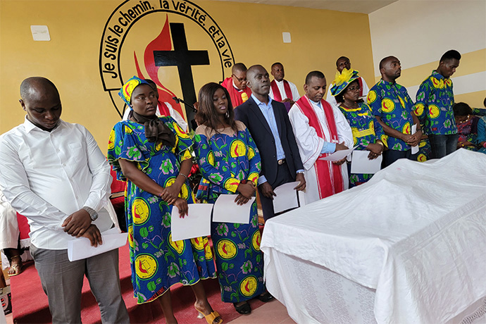 The Rev. Christian Ntondele (center) is surrounded by seven probationary clergy members that he will be working with to grow the United Methodist mission in Brazzaville, Republic of Congo. Ntondele will supervise the new John Wesley United Methodist Church. Photo by the Rev. Fiston Okito, UM News.