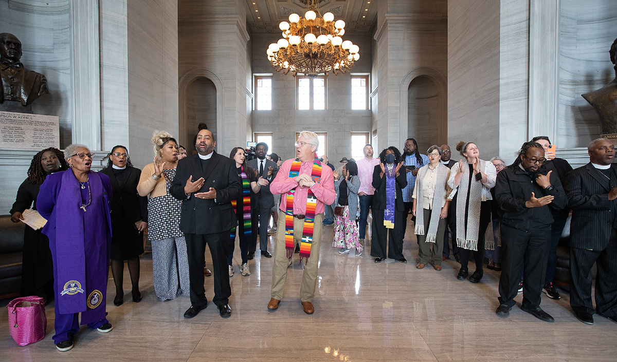 Clergy and other supporters of gun reform sing during a gathering at the Tennessee State Capitol in Nashville. United Methodist and other Christian clergy called on state legislators to enact tighter gun control following a recent school shooting in Nashville. Photo by Mike DuBose, UM News.