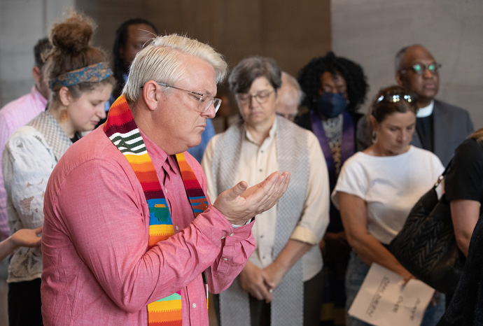 The Rev. Paul Purdue (front) prays during a gathering of clergy calling for gun reform at the Tennessee State Capitol in Nashville. Purdue is pastor of Belmont United Methodist Church in Nashville. Photo by Mike DuBose, UM News.