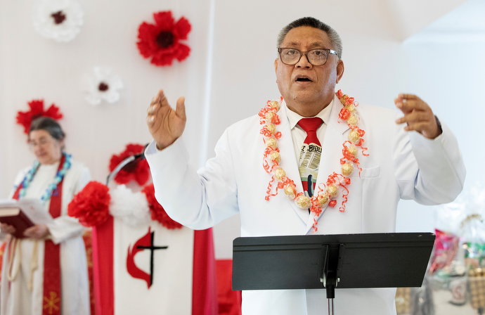 The Rev. Fa’atafa Fulumu’a leads singing during the chartering service for Ola Toe Fuataina United Methodist Church. Photo by Mike DuBose, UM News.
