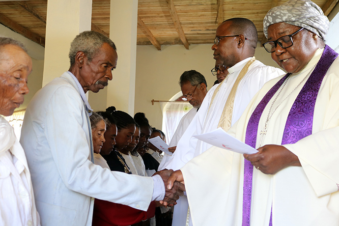 Members of Ambodifasika United Methodist Church are confirmed by Bishop Joaquina Filipe Nhanala (right) during a special service in Ambodifasika, Madagascar, on Feb. 27. To the bishop’s right is the Rev. João Sambô, assistant to the bishop in the Mozambique Episcopal Area. Photo by Alvin Makunike, UM News.